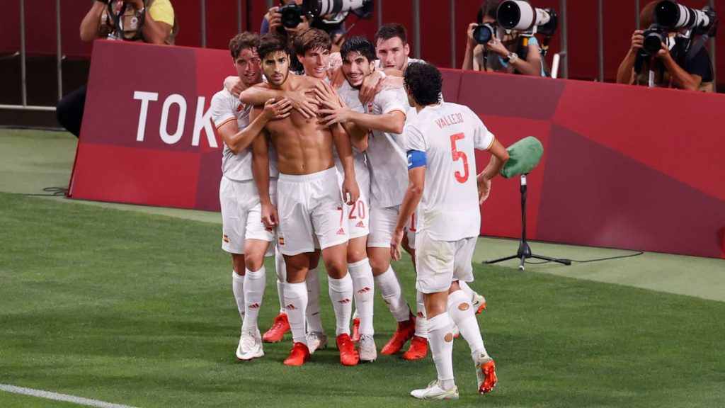 a group of football players hugging